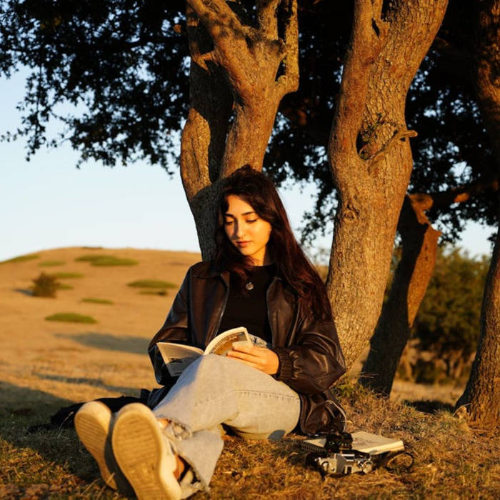 woman reading outdoors